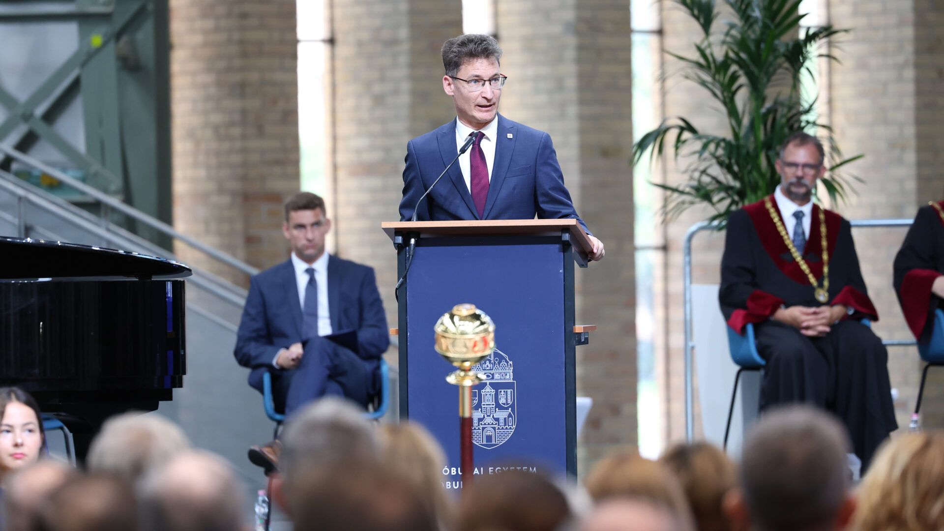 Dr. András Cser-Palkovics giving a speech at the Opening Ceremony