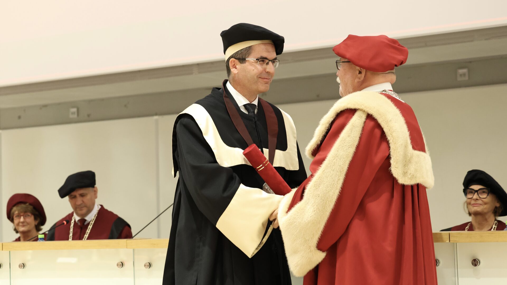 Prof. Dr. Oliver Moravčík awarding the Honorary Docorate to Prof. Dr. Levente Kovács